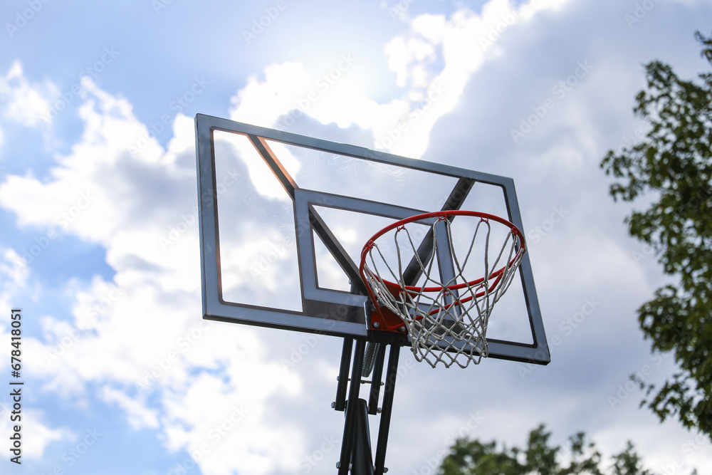 basketball hoop stands tall against a sunset sky, inviting play and capturing the essence of active sports and healthy living. basketball hoop stands tall against a sunset sky, inviting play and capturing the essence of active sports and healthy living.