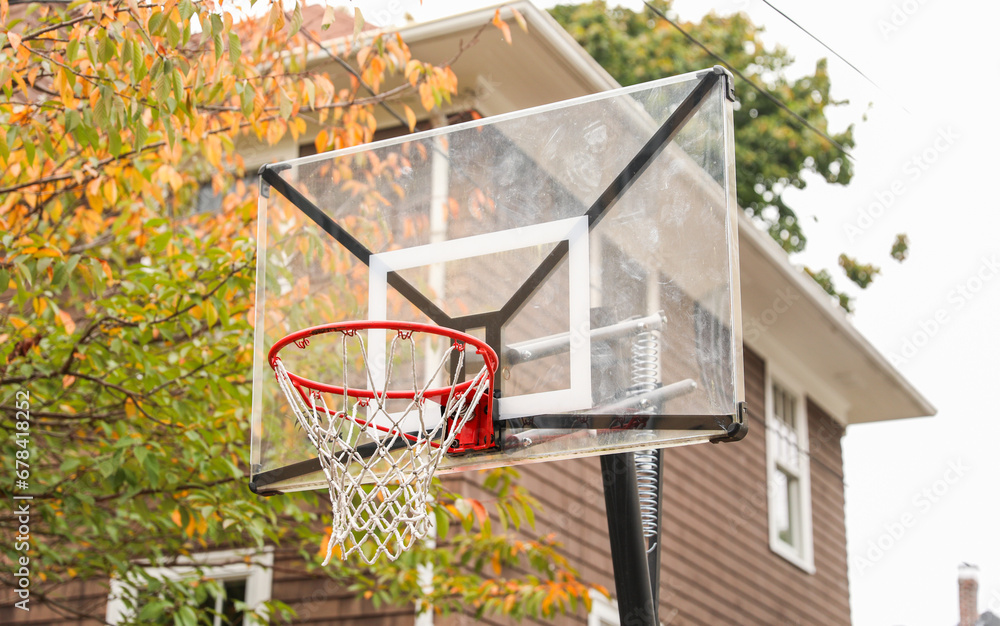 basketball hoop stands tall against a sunset sky, inviting play and