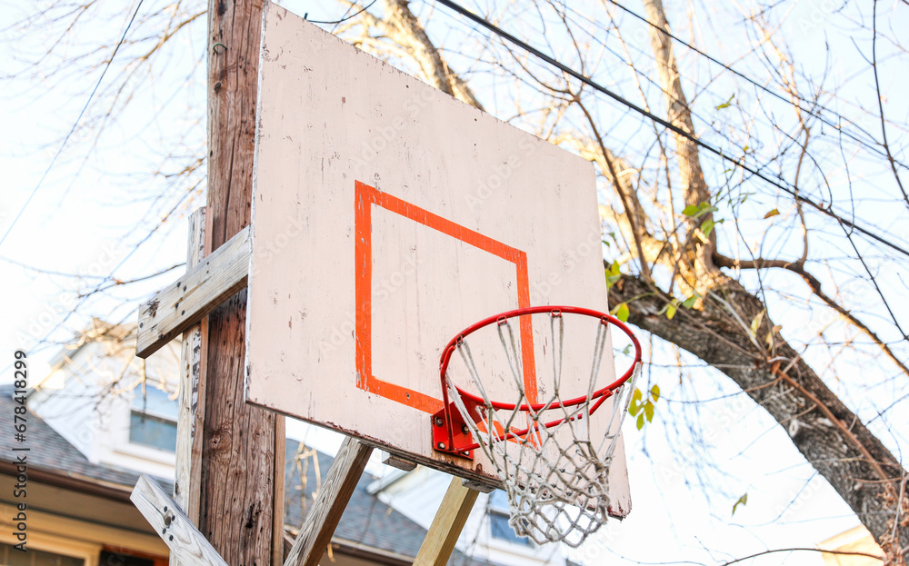 basketball hoop stands tall against a sunset sky, inviting play and capturing the essence of active sports and healthy living.