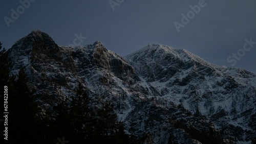 Scenic view of the snow-capped mountains under the dawn sky in the early morning