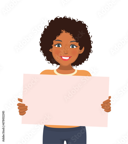 Young African woman holding blank billboard or empty banner for copyspace advertising and announcement messages