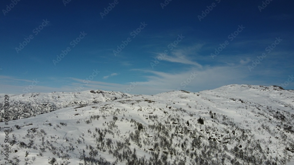 Aerial view of the white snowy hillside