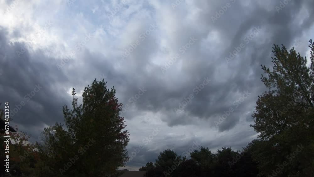Timelapse of the fluffy white clouds in the sky over the forest Timelapse of the fluffy white clouds in the sky over the forest