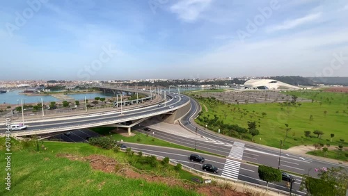 Cars driving on Hassan II bridge with a view over the Grand Theatre of Rabat in Morocco