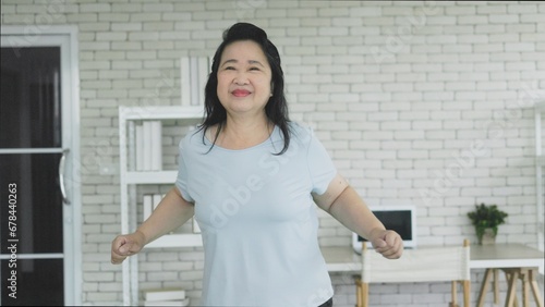 portrait of senior asian woman dance exercise at home