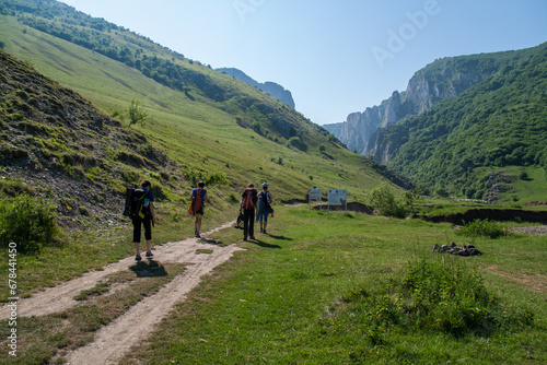 A group of determined individuals trekking together, step by step