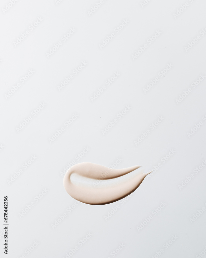 Obraz premium Skincare smudge of tinted face cream on neutral background