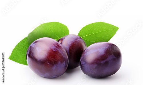 Delicious plums with green leaf