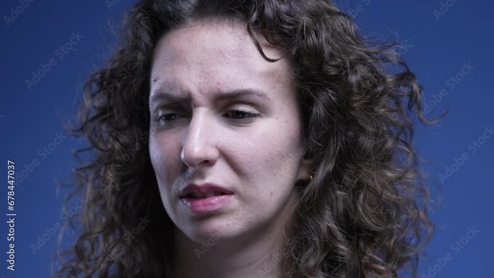 Woman close-up face feeling disgust and revulsion. 20s female person signalling extreme aversion Woman close-up face feeling disgust and revulsion. 20s female person signalling extreme aversion