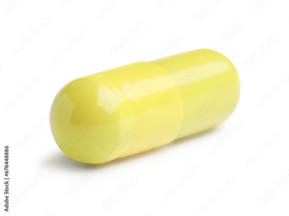 One yellow pill isolated on white. Medicinal treatment