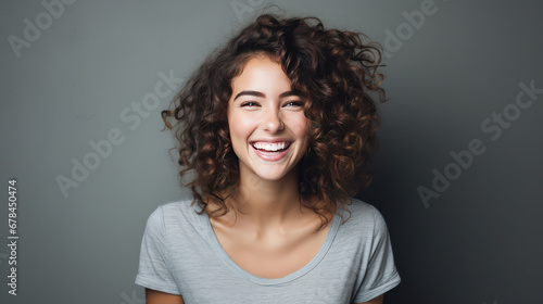 portrait of a happy curly hair young woman