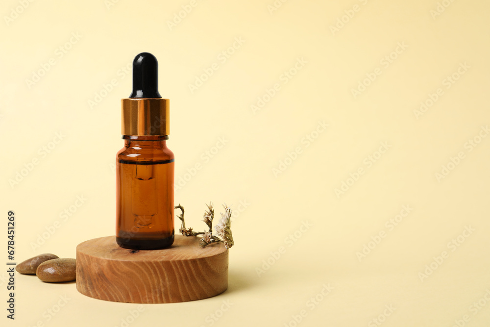 Composition with bottle of cosmetic serum on beige background. Space for text Composition with bottle of cosmetic serum on beige background. Space for text