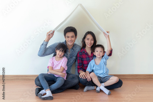 Asian family sit togather in new house with home icon concept © anekoho
