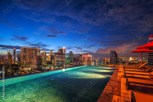 Photography swimming pool and roof top bar on hotel deck in Bangkok city