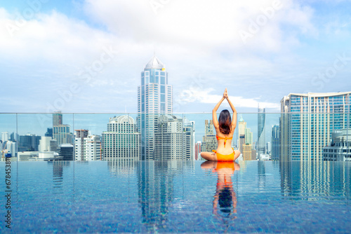 Photography Asian traveller woman sleep and relax at swimming pool