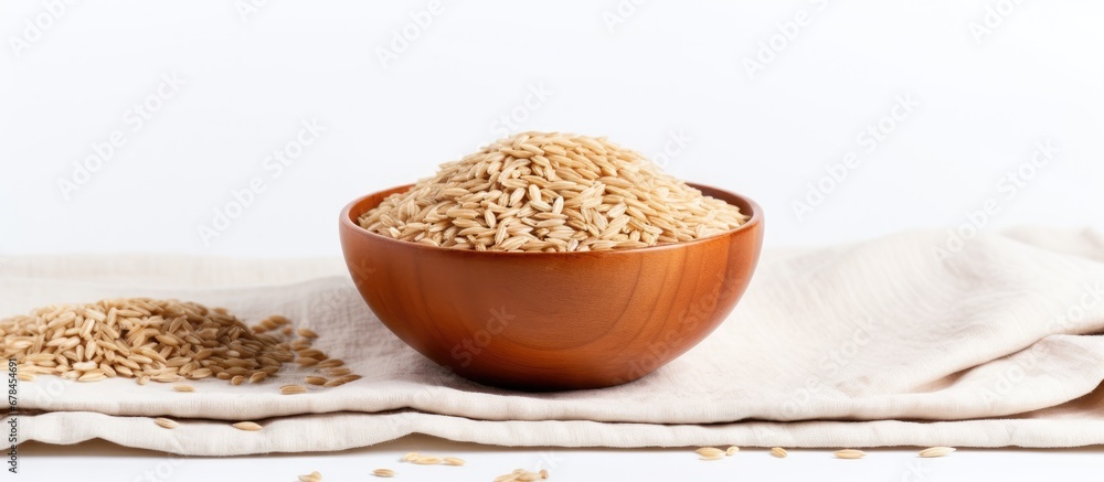 Brown rice served in a bowl on a white table Brown rice served in a bowl on a white table