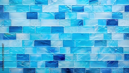 A mosaic of aquacolored glass tiles, arranged to mimic the shifting patterns of waves on the surface of water. photo