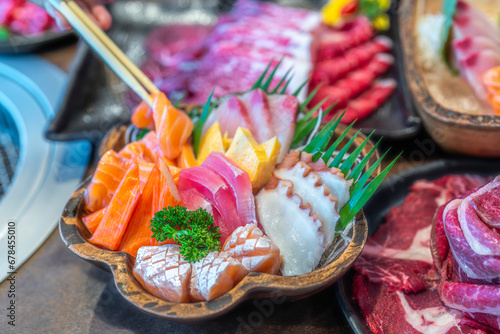 wagyu beef in plate on korean barbeque table in Japanese restaurant photo