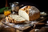 A freshly baked loaf of traditional Irish soda bread, golden brown and dusted with flour, sitting on a rustic wooden table with a knife and butter nearby, ready to be sliced and served