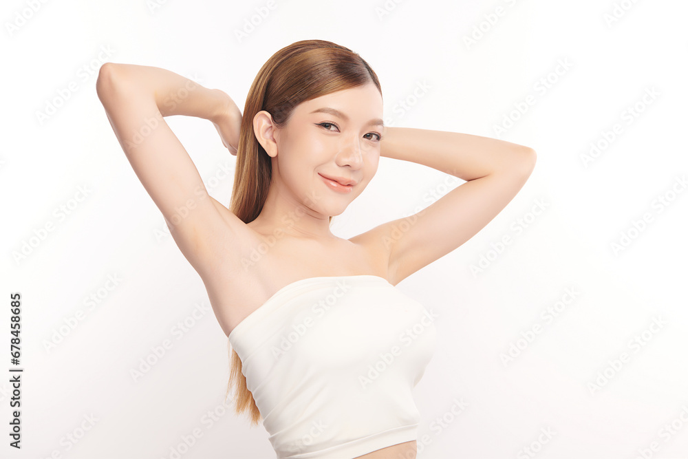 Beautiful Young Asian woman lifting hands up to show off clean and hygienic armpits or underarms on white background, Smooth armpit cleanliness and protection concept Beautiful Young Asian woman lifting hands up to show off clean and hygienic armpits or underarms on white background, Smooth armpit cleanliness and protection concept