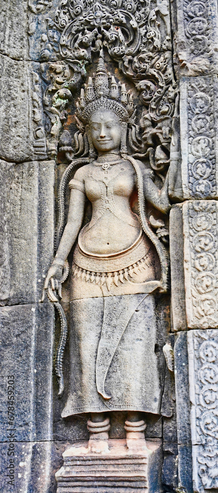 A Stone bas reliefs depicting a Goddess, carved in stone at Bayon Temple at Siem Reap, Cambodia, Asia