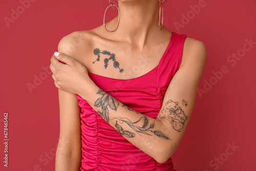 Tattooed young woman on pin...