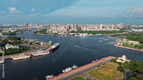 Aerial 4k footage of Tainan city with river crossing in the middle and boats in Taiwan. photo