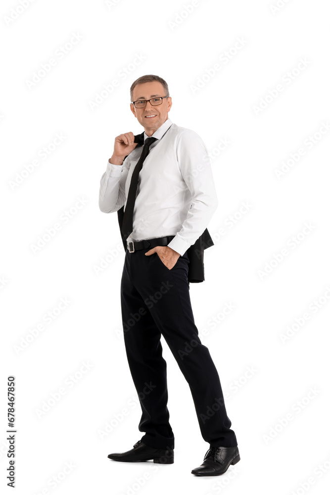 Mature businessman walking on white background