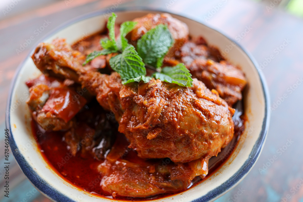 Spicy red chicken curry. Goan style chicken vindaloo. Butter chicken Murgh Makhani curry roast hot and spicy gravy dish Dhaba Punjab, India. North Indian non-vegetarian cuisine Garam Masala. tikka Spicy red chicken curry. Goan style chicken vindaloo. Butter chicken Murgh Makhani curry roast hot and spicy gravy dish Dhaba Punjab, India. North Indian non-vegetarian cuisine Garam Masala. tikka