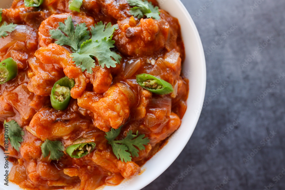Gobi Manchurian curry gravy, Gobi 65, chilly gobi or cauliflower fry. Popular street food of India made of cauliflower florets Mumbai India. Gobi Manchurian curry gravy, Gobi 65, chilly gobi or cauliflower fry. Popular street food of India made of cauliflower florets Mumbai India.