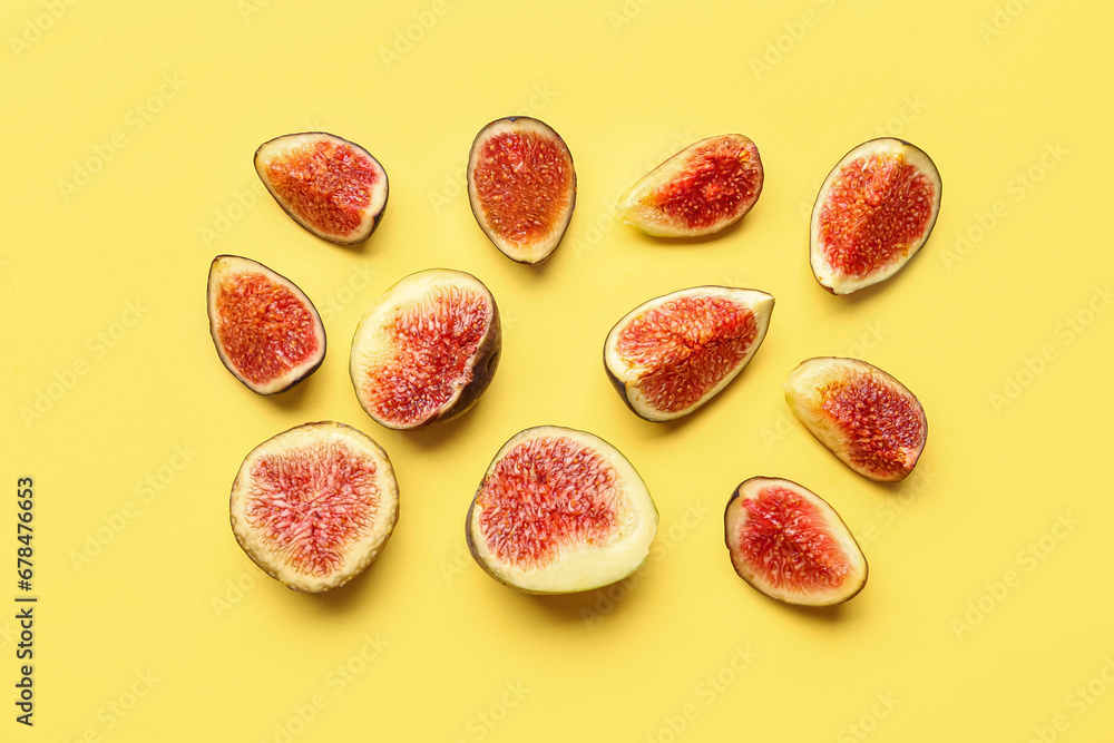 Cut fresh figs on yellow background