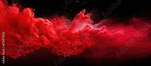 Colorful powders exploding frozen in motion with glitter on white background