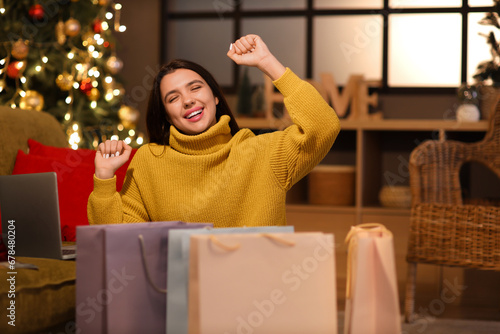 Happy young woman with shop...
