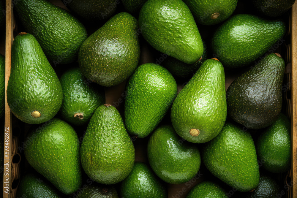 Pile of ripe avocados in wooden crate, top view Pile of ripe avocados in wooden crate, top view