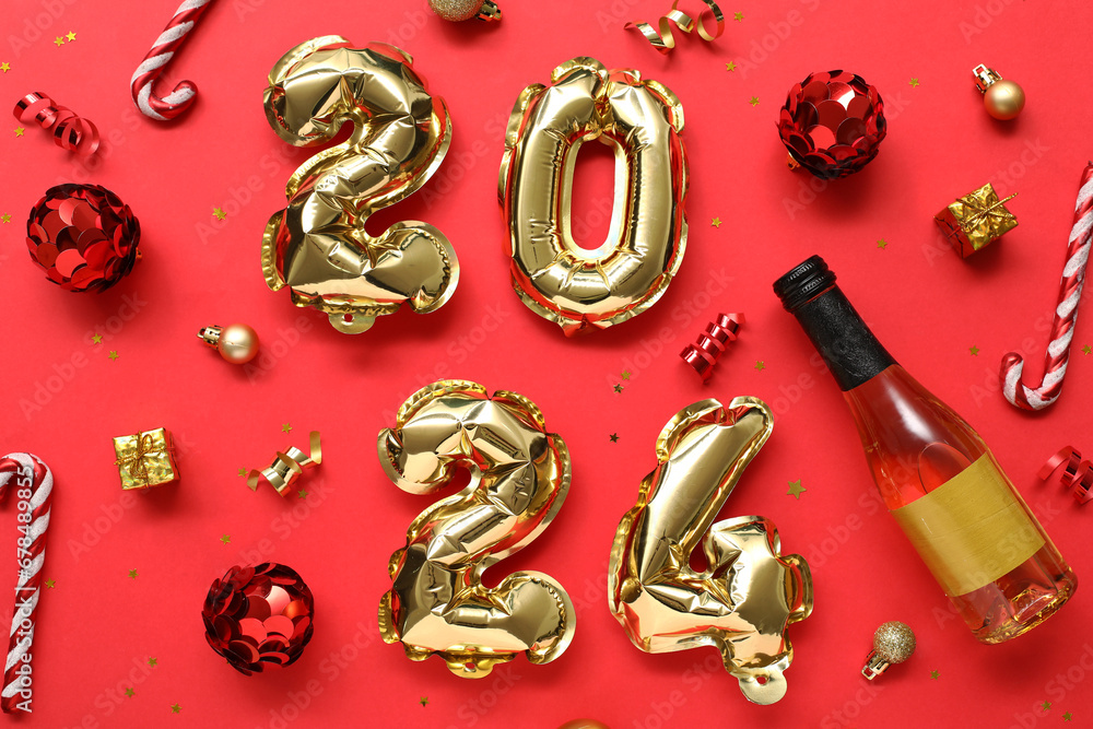 Composition with figure 2024 made of foil balloons, champagne and Christmas decorations on red background Composition with figure 2024 made of foil balloons, champagne and Christmas decorations on red background
