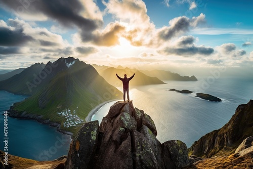 Man standing on the top of a mountain and enjoying the view