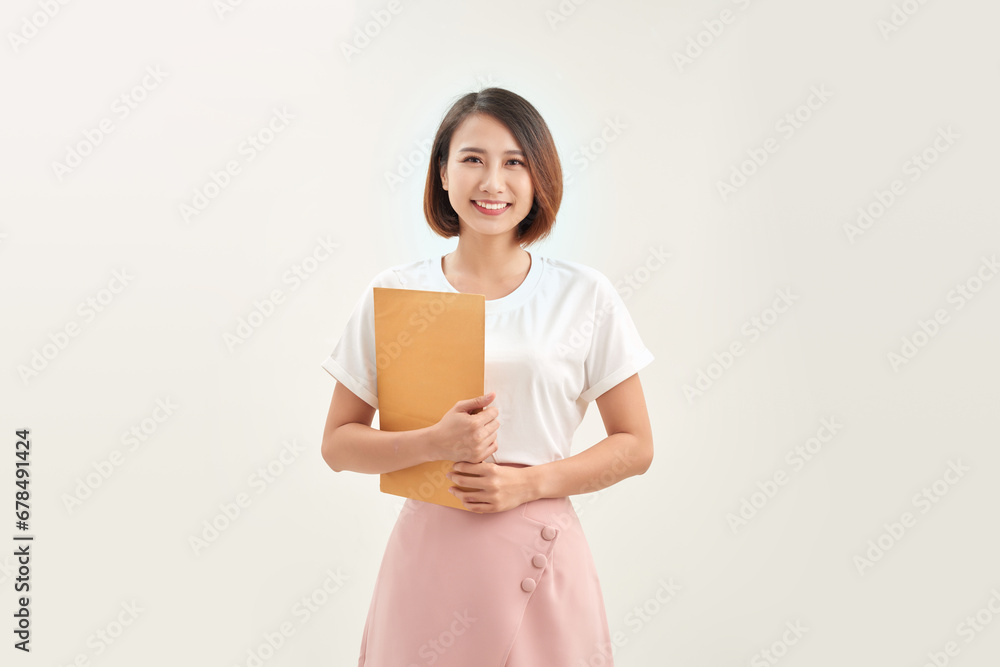 Businesswoman showing letter in yellow envelope Businesswoman showing letter in yellow envelope