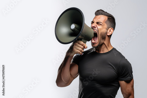 Side view of a man shouting into a loudspeaker