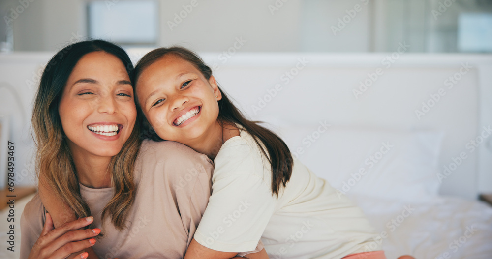 Portrait, family and a mother hugging her daughter in the bedroom of a home in the morning together. Face, smile and a happy young girl embracing her single parent while on a bed in their apartment Portrait, family and a mother hugging her daughter in the bedroom of a home in the morning together. Face, smile and a happy young girl embracing her single parent while on a bed in their apartment
