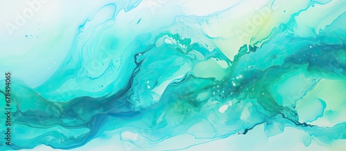 Minty green ink splash on turquoise background with abstract waves