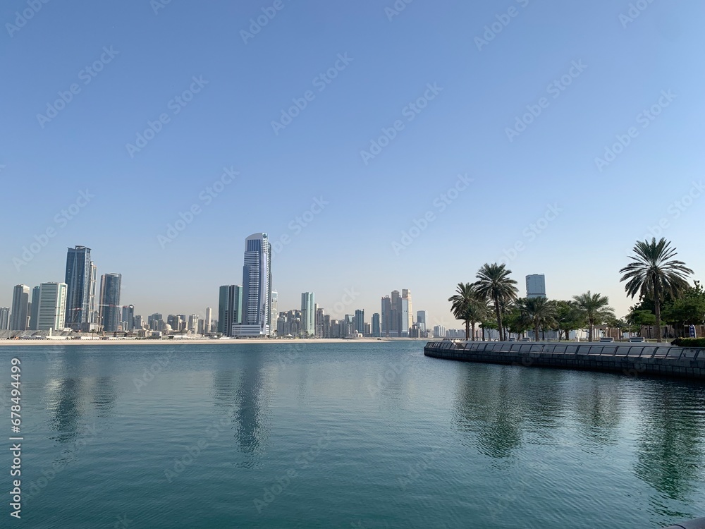 View of the Sharjah skyline taken from Al Mamzar beach in Dubai, United Arab Emirates View of the Sharjah skyline taken from Al Mamzar beach in Dubai, United Arab Emirates