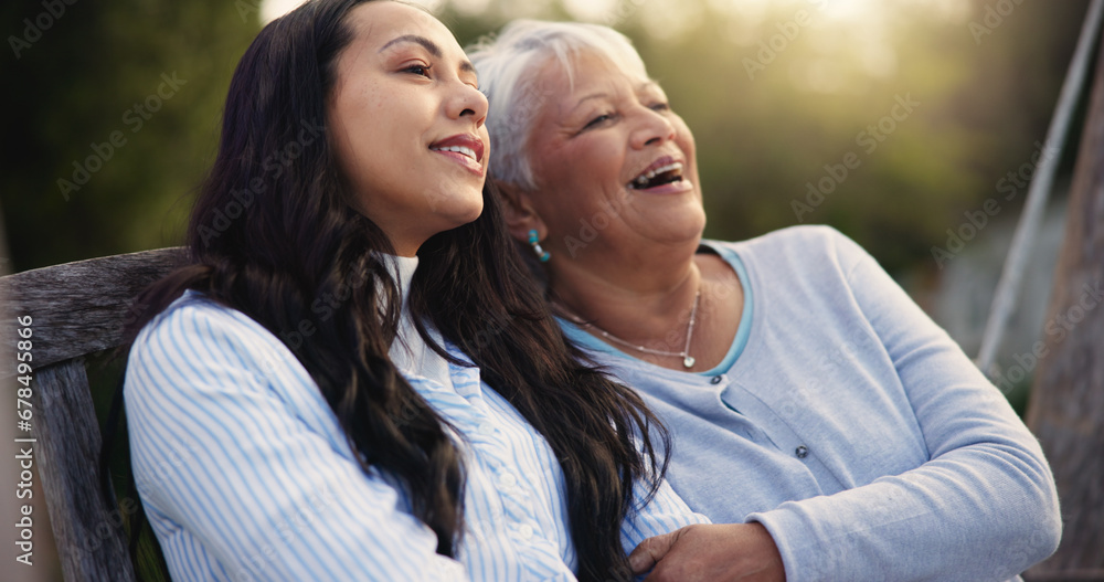 Happy, senior and mother with woman on bench, nature and bonding hug for laugh on retirement. Mature person, parent and older daughter for together in park, care and love with funny joke in garden Happy, senior and mother with woman on bench, nature and bonding hug for laugh on retirement. Mature person, parent and older daughter for together in park, care and love with funny joke in garden