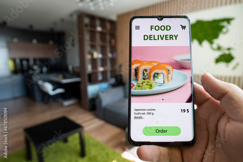 fast food and fast delivery when ordering online concept. Order and deliver food online. Eat from smartphone. Gadget on blue background. order meal in a restaurant using the app on your mobile phone.