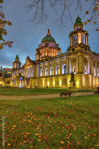 The illuminated Belfast City Hall at dawn in autumn