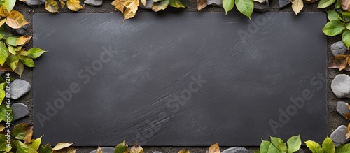 Laying leaf covered board in garden as backdrop