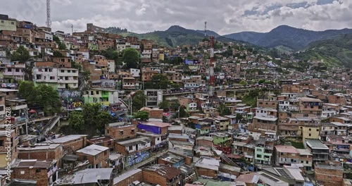 Medellin Colombia Aerial v39 drone flyover famous Comuna 13 capturing La Independencia Calle 35f and hillside slums with overpopulated residential houses - Shot with Mavic 3 Cine - November 2022 photo