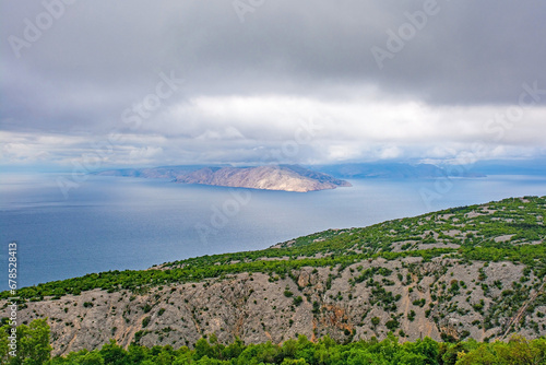 A stormy late spring on the Adriatic coast of Croatia near the town of Klada in Lika-Senj county. Looking towards Otok Prvic island photo