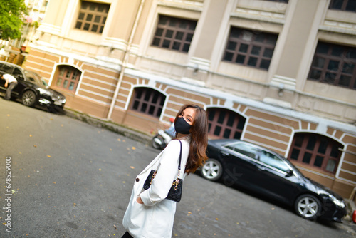 Young woman wearing sunglasses in city, colorful buildings and feel the warm. Exploring this bustling metropolis is a true adventure