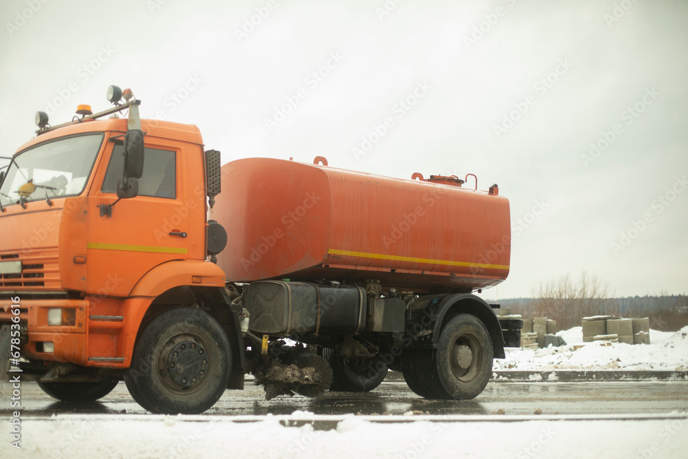 Truck with a cesser. Transportation of water. Large tank on the truck. Truck with a cesser. Transportation of water. Large tank on the truck.