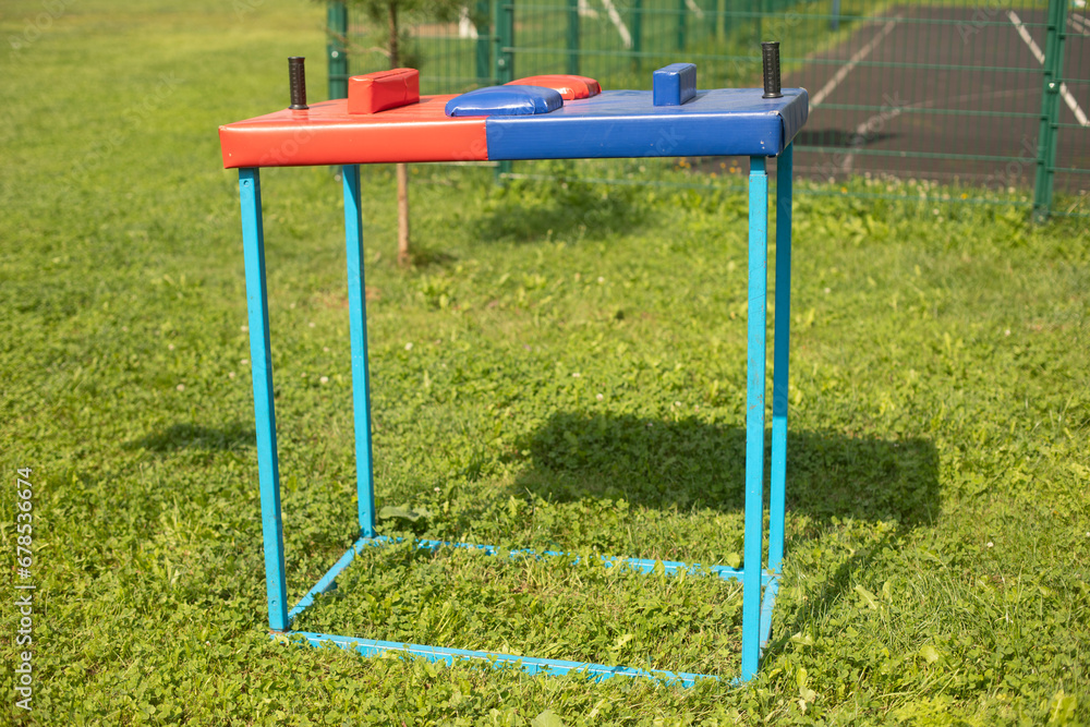 Arm wrestling machine. Sports equipment for arm strength training. Equipment at the wrestling tournament. Arm wrestling machine. Sports equipment for arm strength training. Equipment at the wrestling tournament.